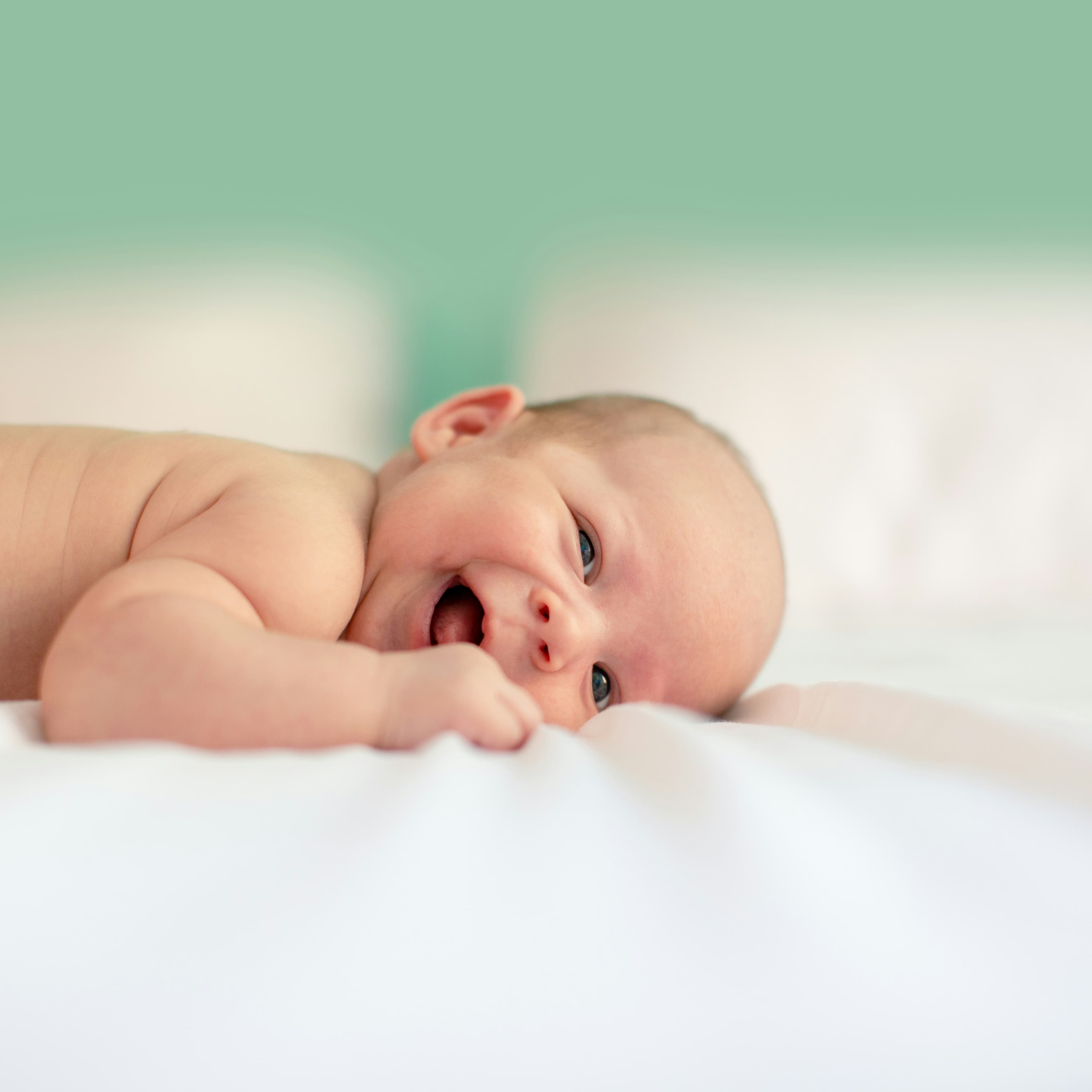 Baby lying on soft fabric — what it means to need people