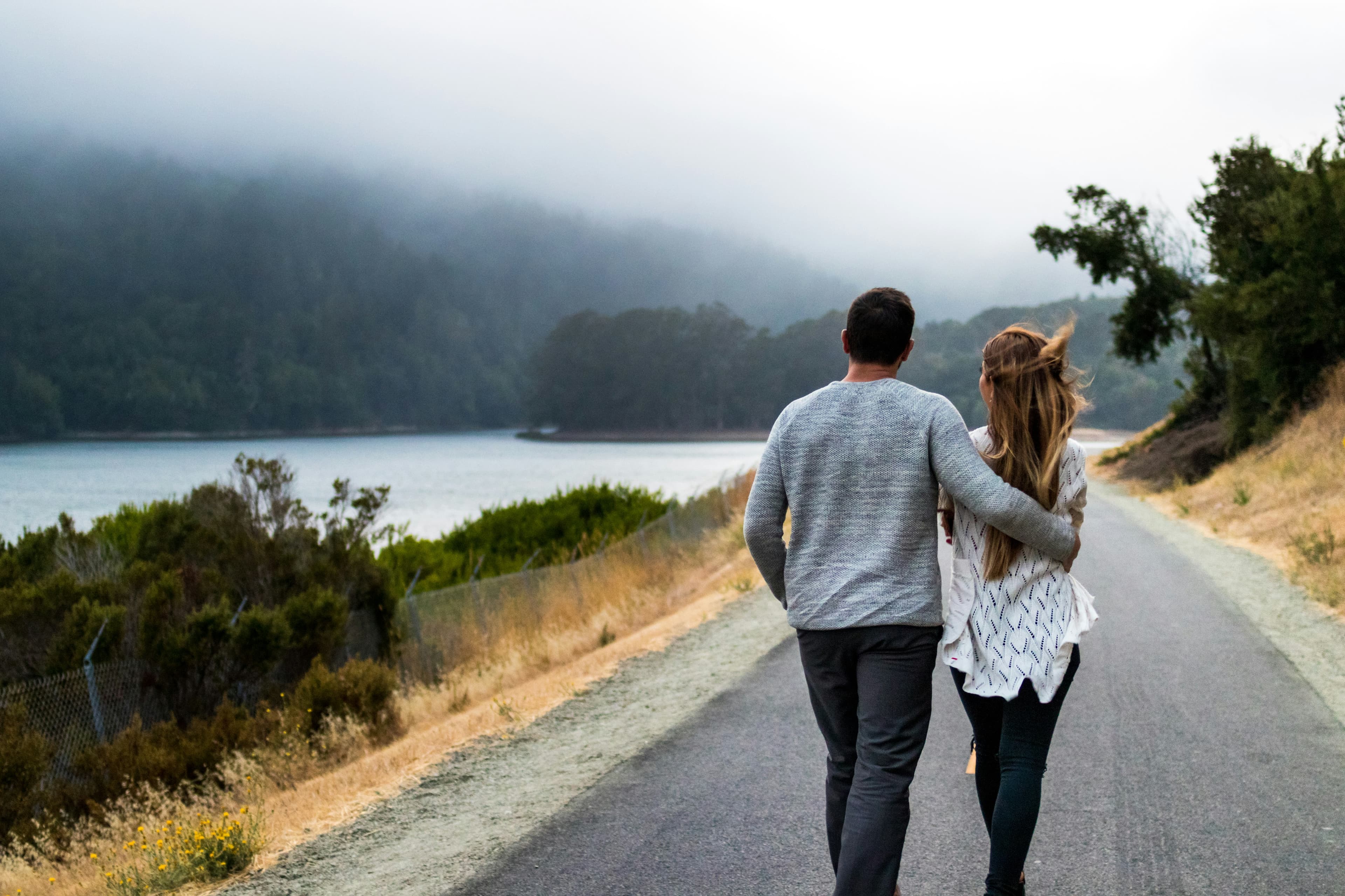 Couple walking down a road together — starting couples therapy